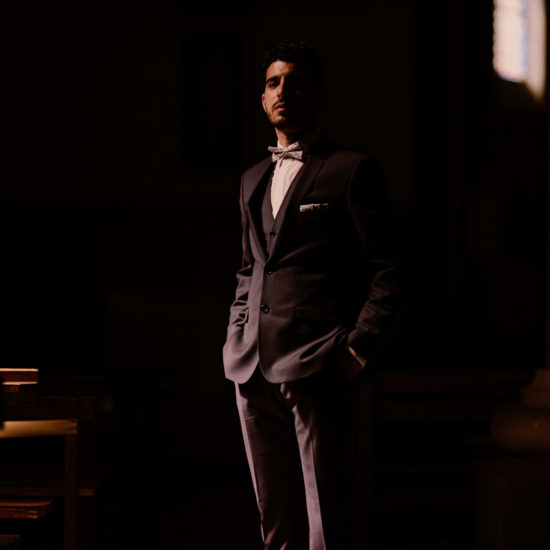 Lowkey portrait of the groom in the church of Sainte Jeanne d&#039;Arc in Toulon
